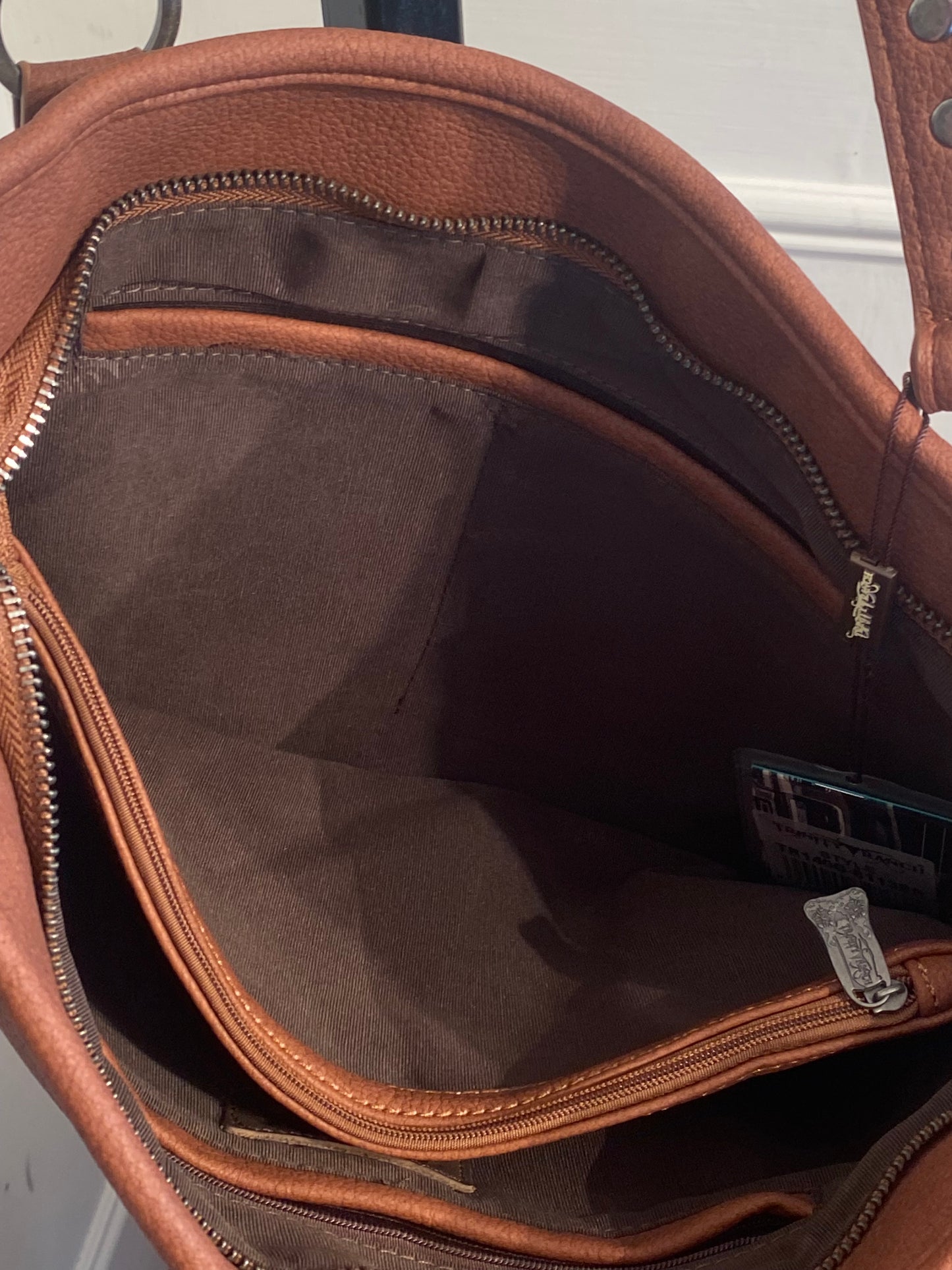 TRINITY RANCH HAIR ON COWHIDE CONCEALED CARRY TOTE